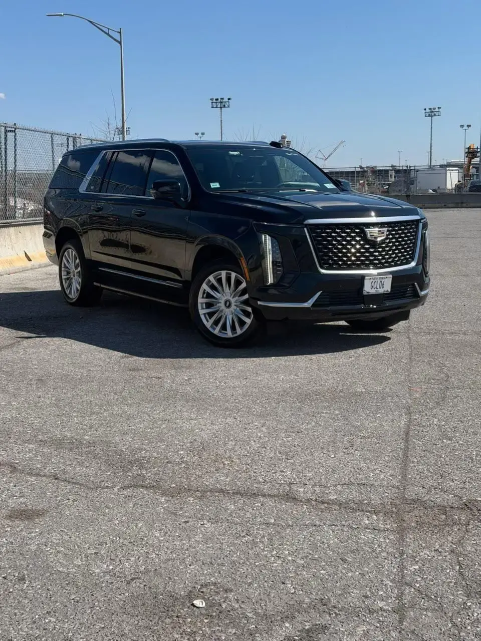 Black Cadillac Escalade ESV by Golden Class Limo, New York plate GCL 06