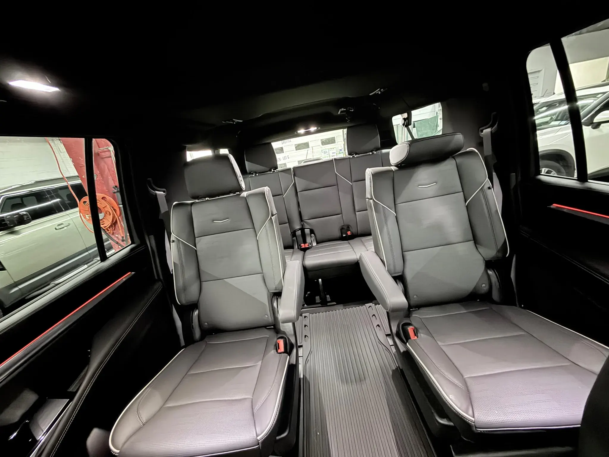 Inside a Golden Class Limo Cadillac Escalade — black leather captain's chairs