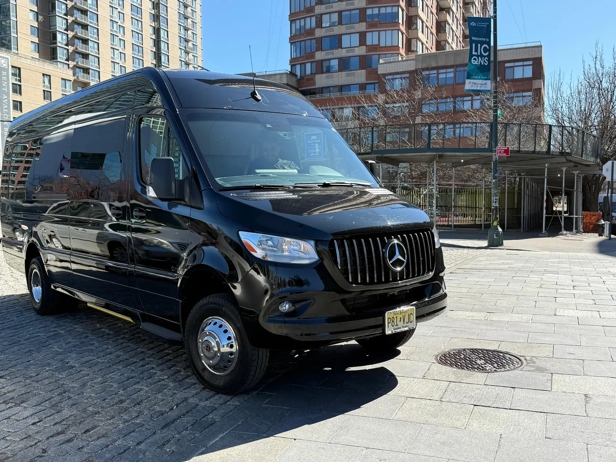 Black Mercedes-Benz Sprinter van on a Long Island City street